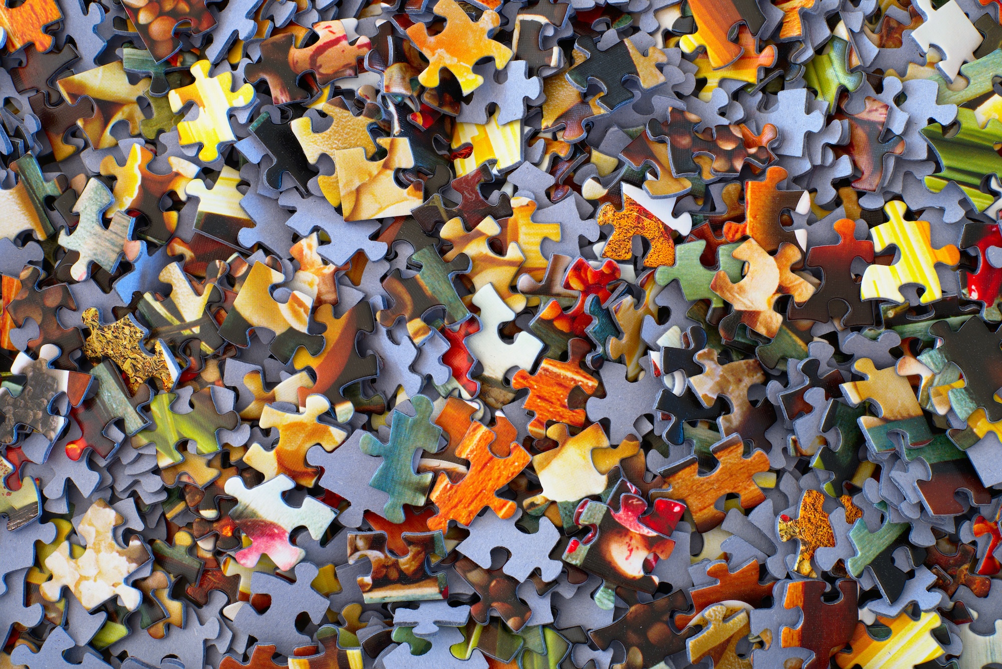 A pile of jigsaw puzzle pieces